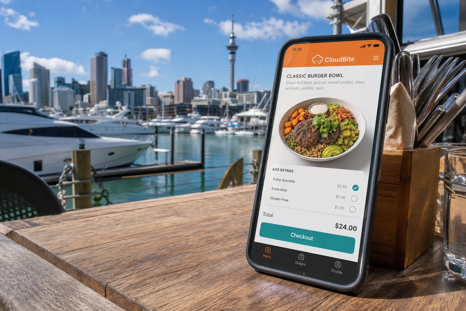 Sunny Auckland waterfront with a smartphone showing an original virtual restaurant menu