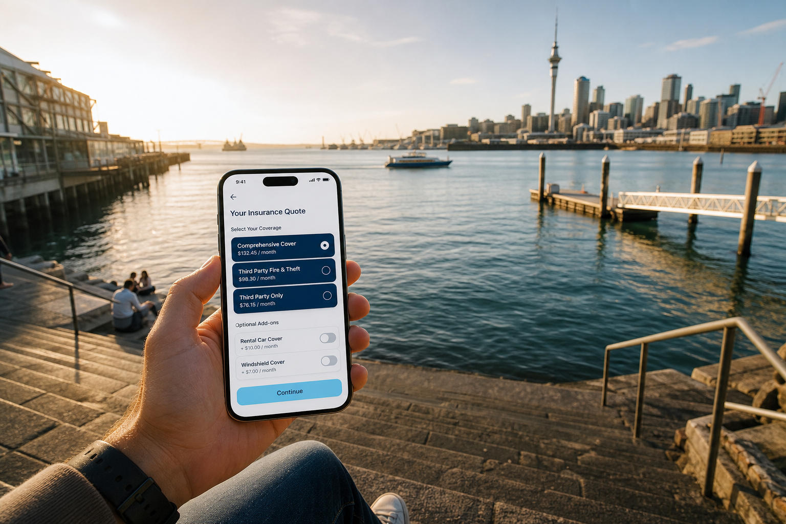 Sunny Auckland waterfront with a smartphone showing an original insurance quote and policy app